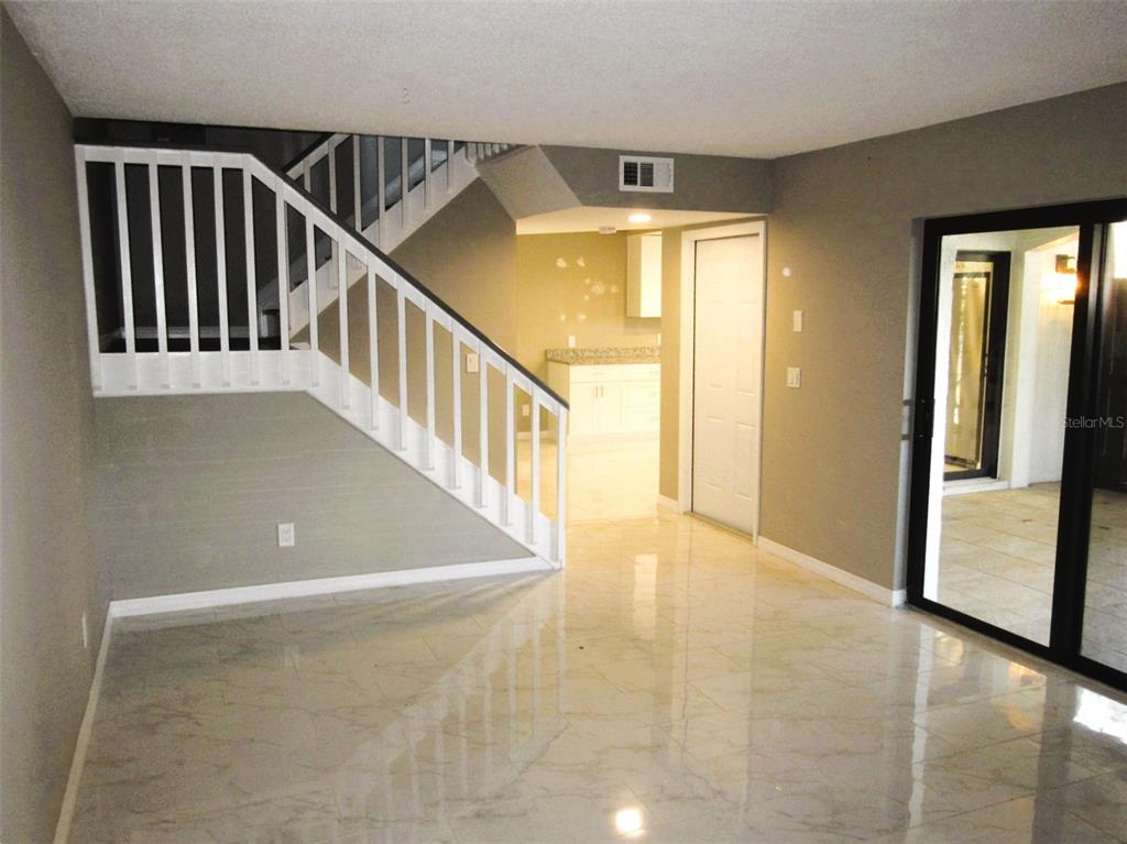 17455 Overhill Drive, Unit B Fort Myers, FL 33908 - Photo 8 of 13 a view of a hallway with windows