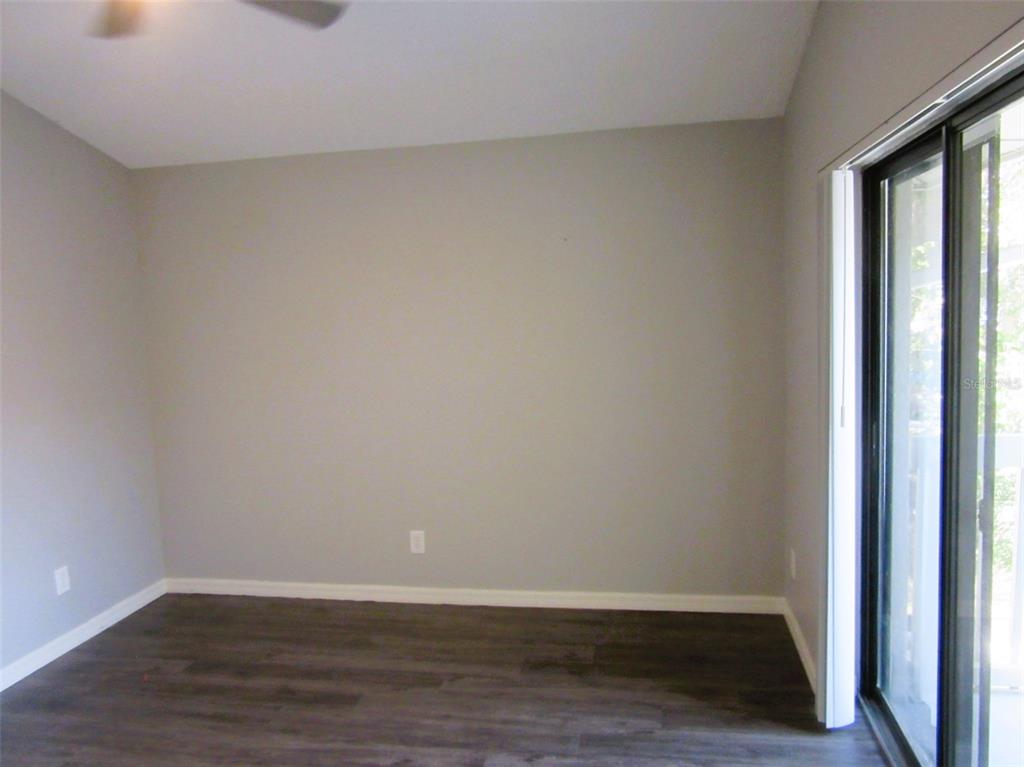 17455 Overhill Drive, Unit B Fort Myers, FL 33908 - Photo 10 of 13 a view of an empty room and wooden floor