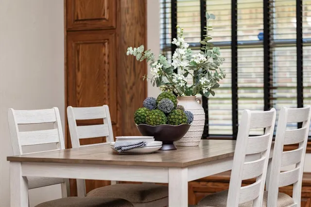 a view of a vase of flowers sitting on a table