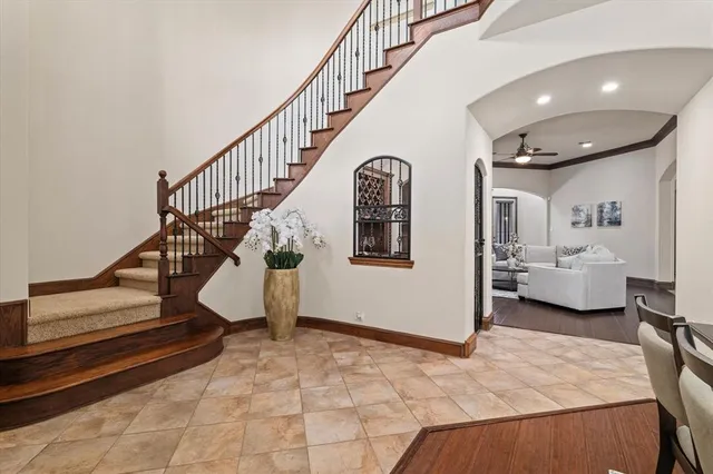 a view of entryway bedroom and hall with wooden floor
