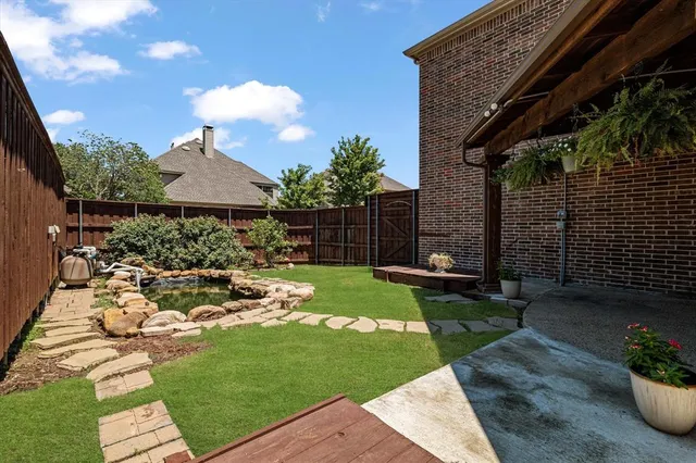 a view of yard with patio