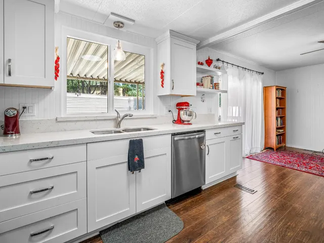 a utility room with cabinets a washer and dryer