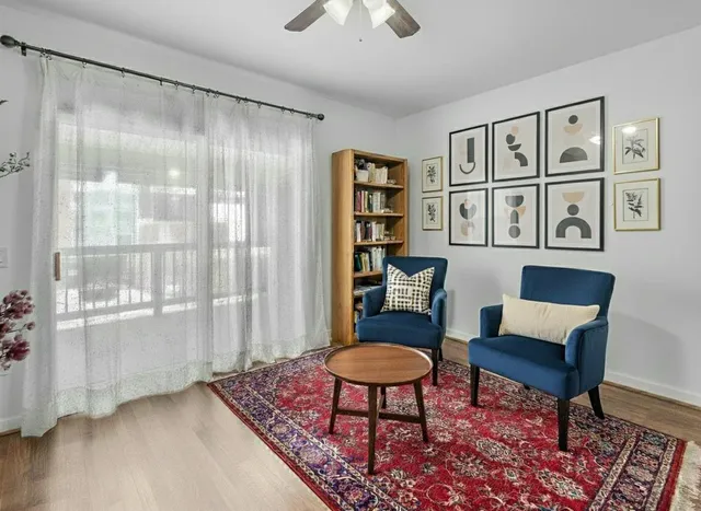 a living room with furniture and a rug
