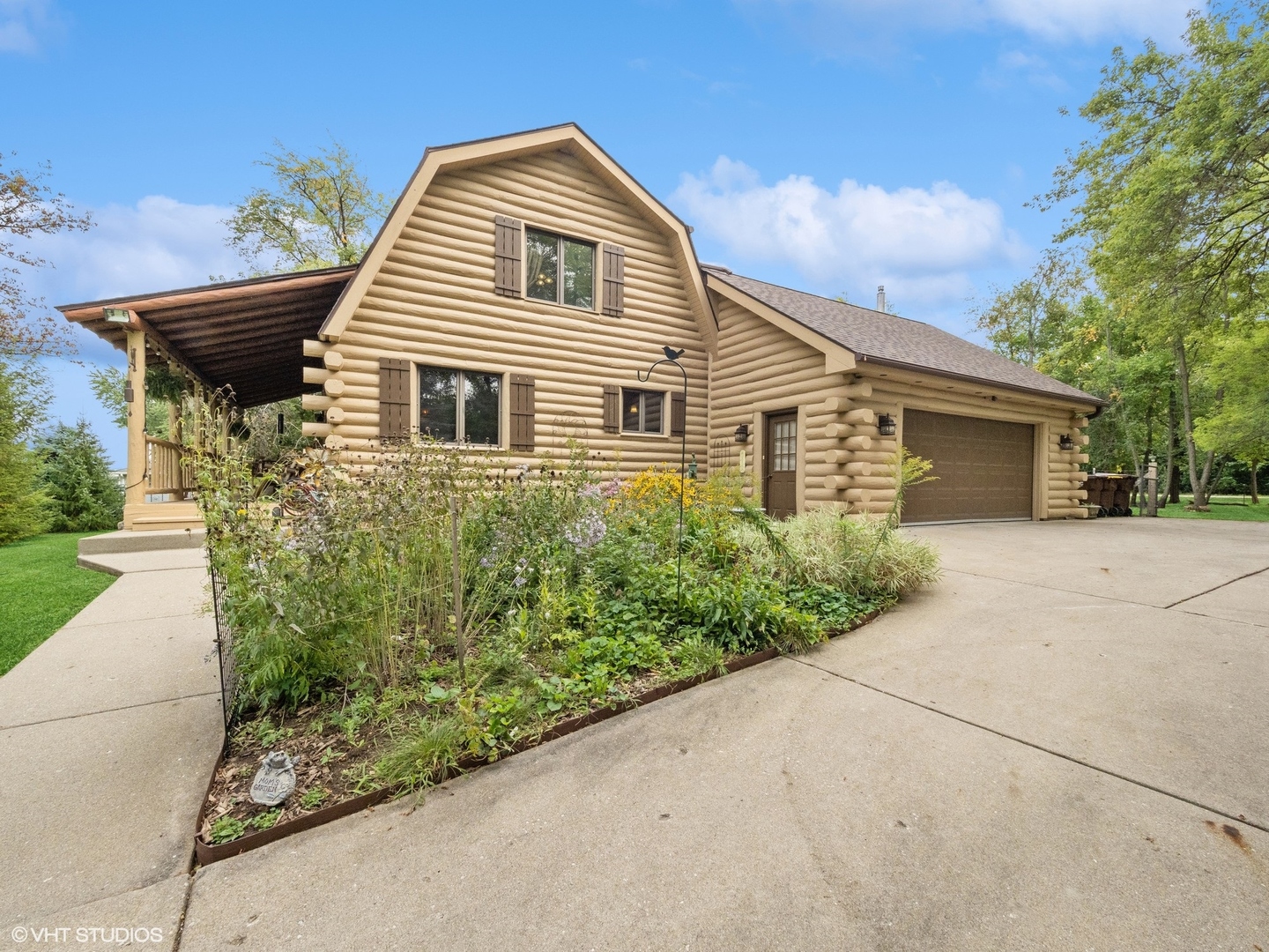 1919 Sherman Boulevard Crystal Lake, IL 60014 - Photo 1 of 26 a front view of a house with a garden