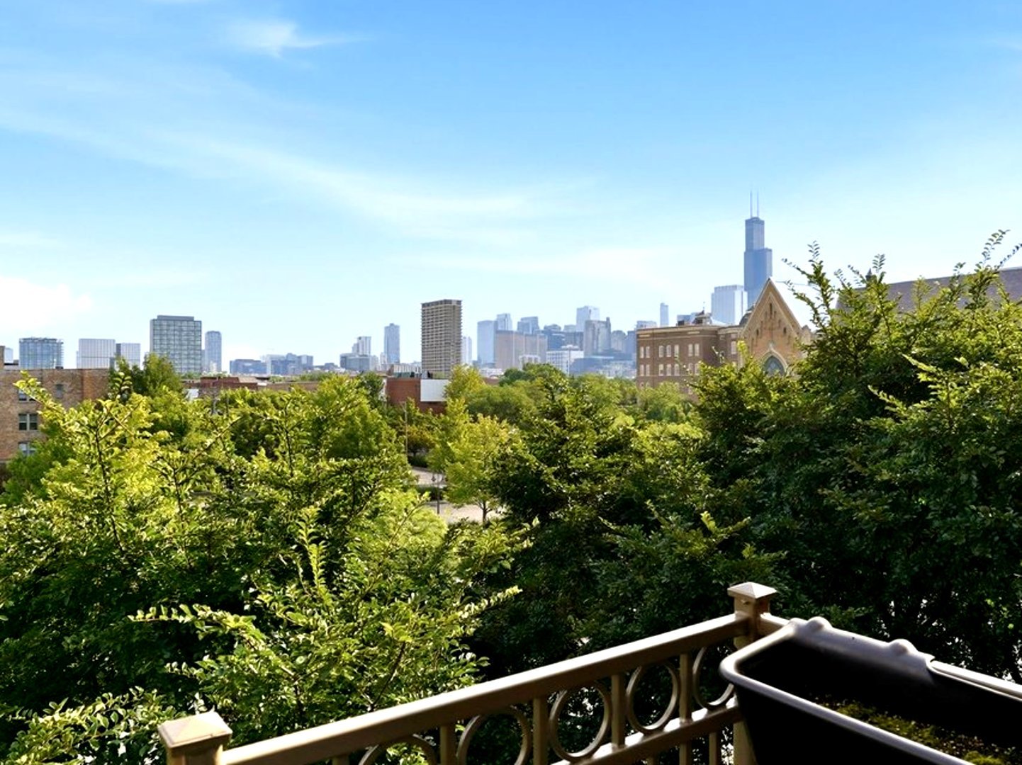 1155 West Roosevelt Road, Unit 404 Chicago, IL 60608 - Photo 23 of 30 a view of a city from a balcony