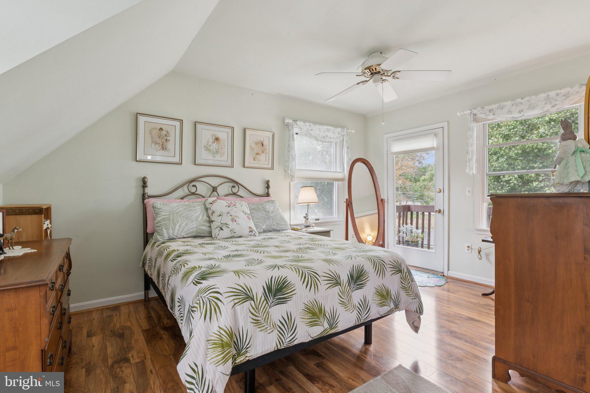 968 Chesapeake Avenue Deale, MD 20751 - Photo 19 of 57 a bedroom with a large bed and a window