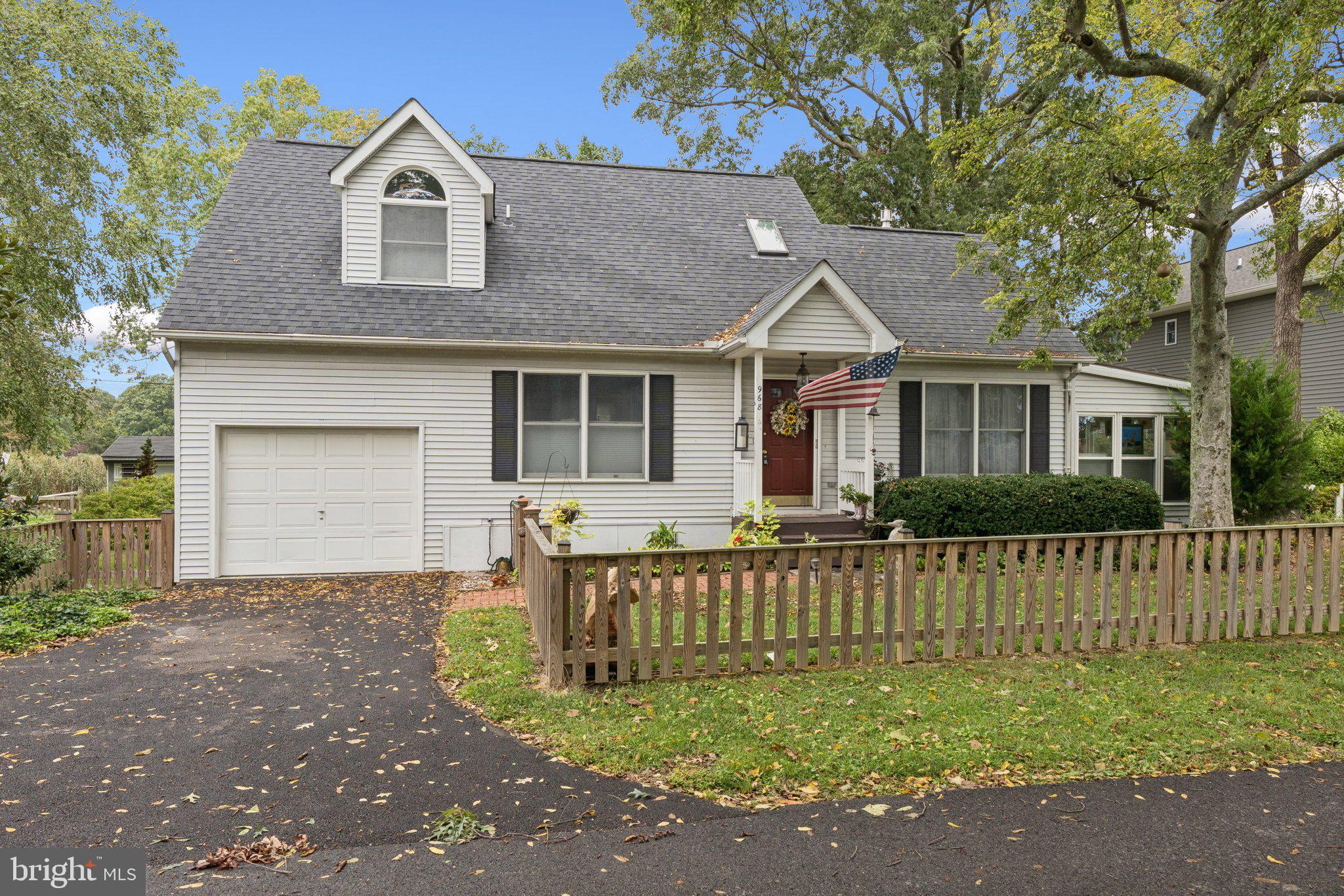 968 Chesapeake Avenue Deale, MD 20751 - Photo 2 of 57 a front view of a house with a yard