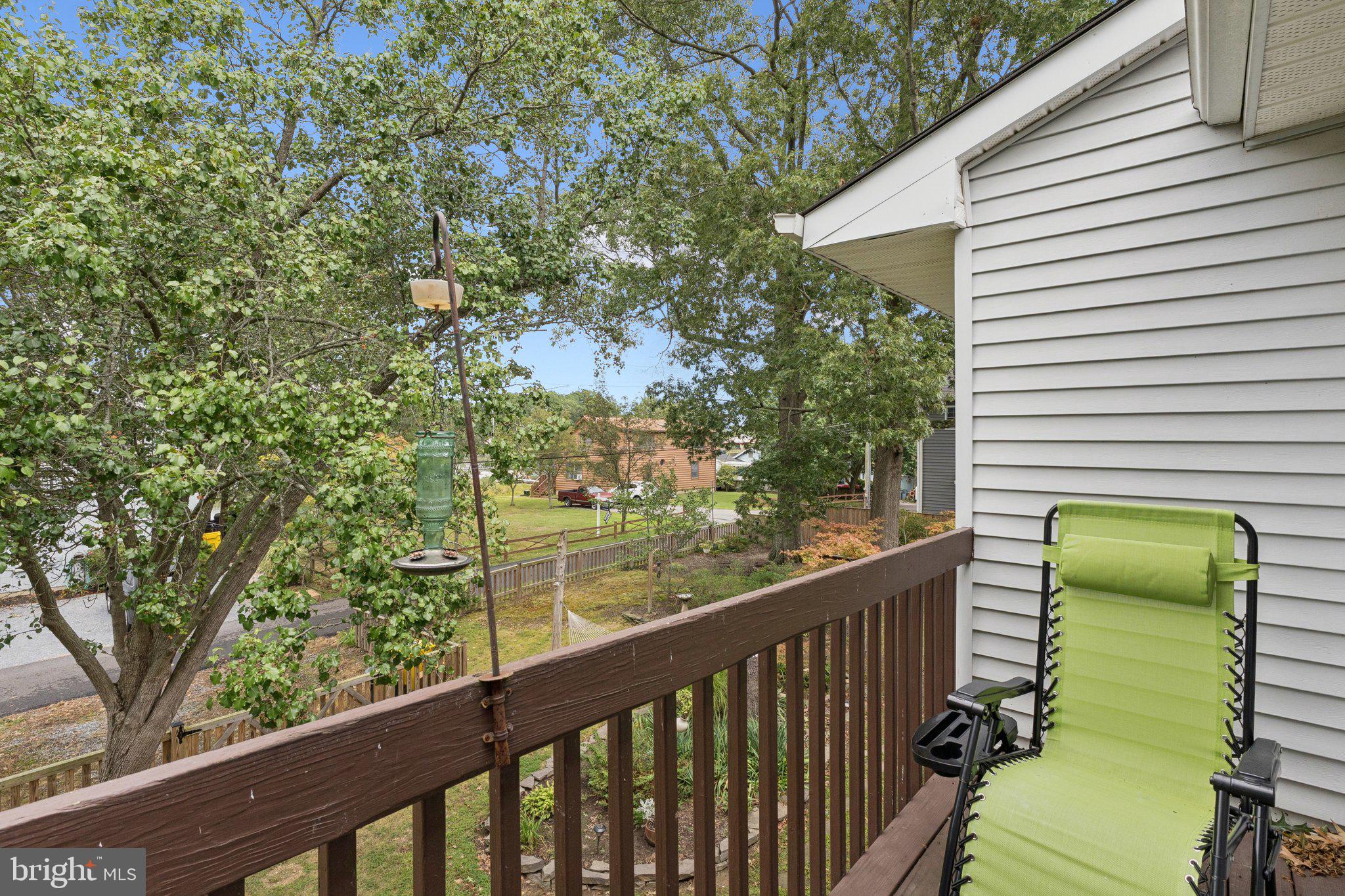 968 Chesapeake Avenue Deale, MD 20751 - Photo 22 of 57 a view of a balcony with chair and a tree