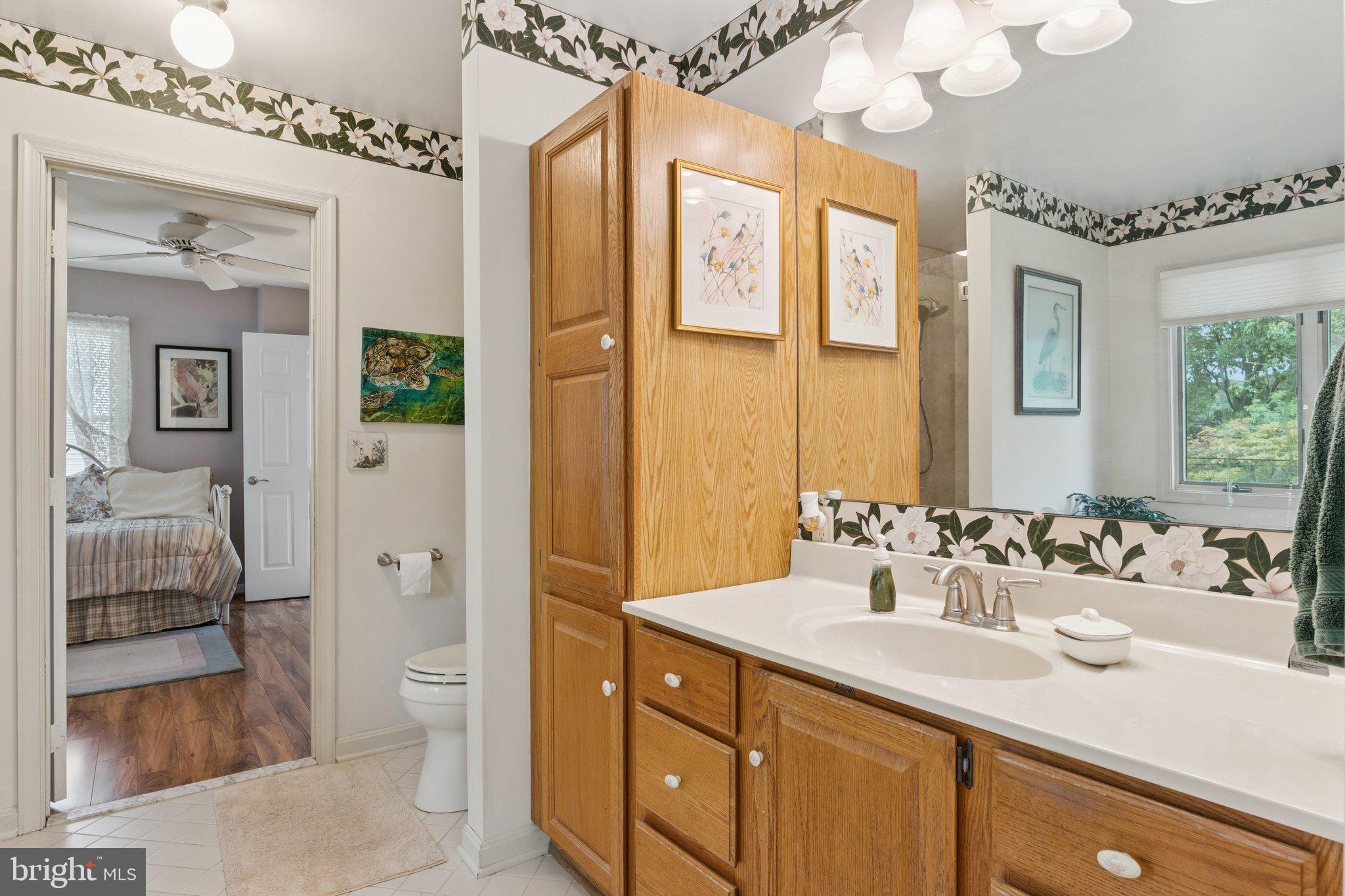 968 Chesapeake Avenue Deale, MD 20751 - Photo 24 of 57 a bathroom with a sink a toilet and shower