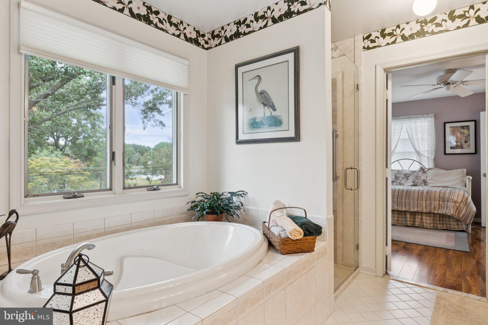 968 Chesapeake Avenue Deale, MD 20751 - Photo 25 of 57 a bath tub sitting in a bathroom next to a window