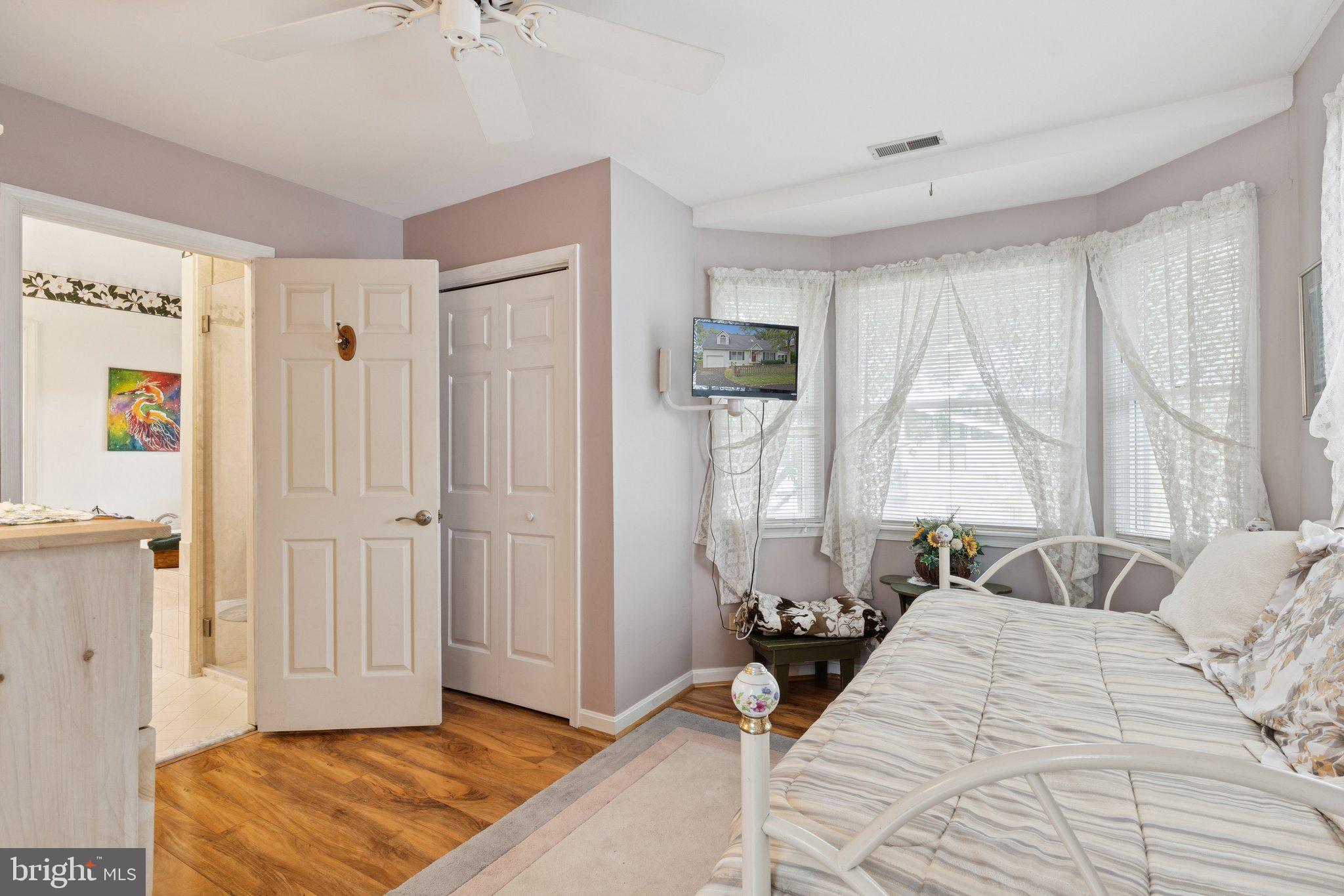 968 Chesapeake Avenue Deale, MD 20751 - Photo 27 of 57 a bedroom with a bed and a window