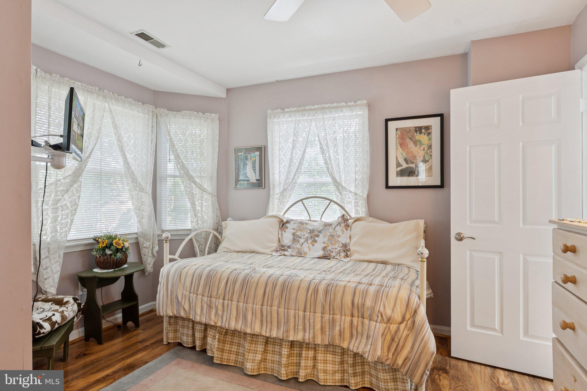 968 Chesapeake Avenue Deale, MD 20751 - Photo 28 of 57 a bedroom with a bed and a window