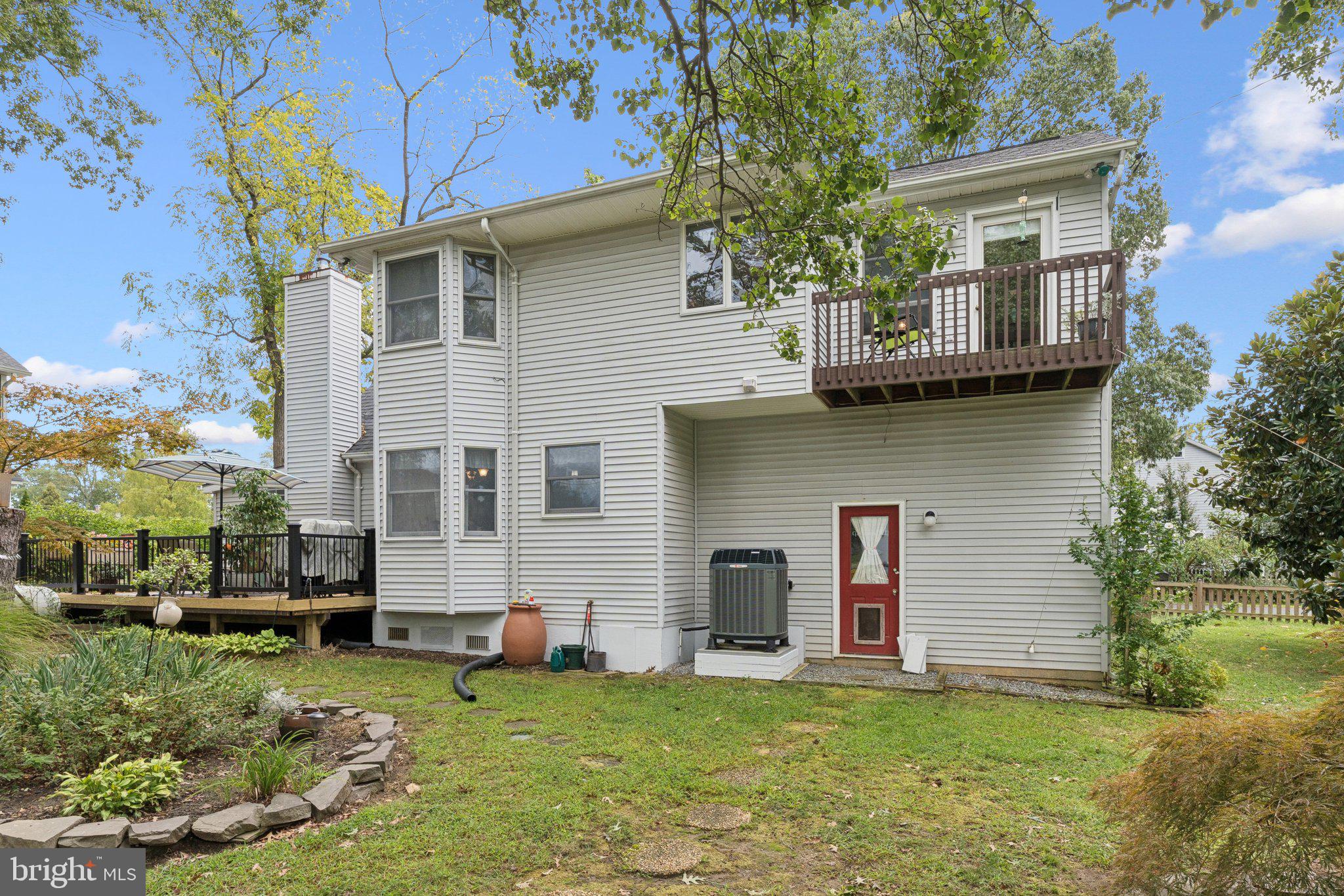 968 Chesapeake Avenue Deale, MD 20751 - Photo 35 of 57 a view of a backyard with table and chairs and large tree