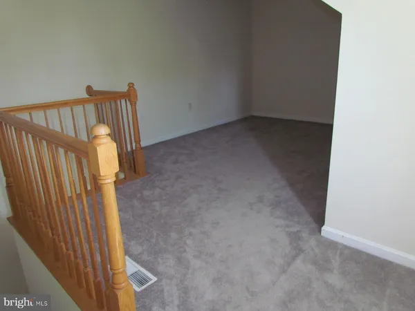 a view of staircase with utility area
