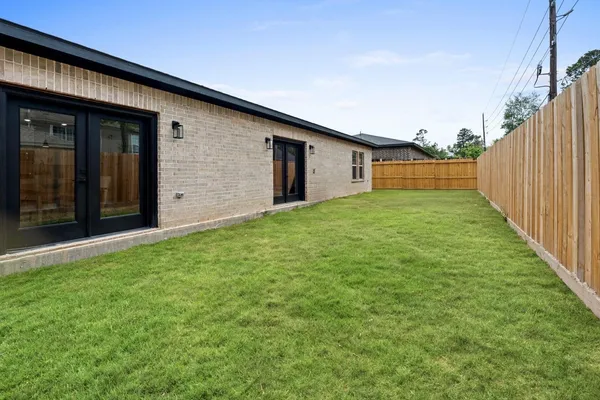 a backyard of a house with lots of green space
