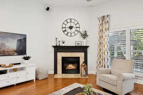 a living room with furniture and a fireplace