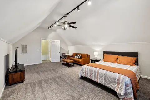 a bedroom with two beds and painted walls