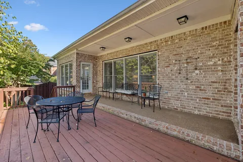 a patio with table and chairs