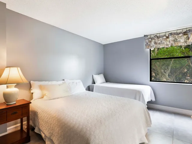 a bedroom with bed and window