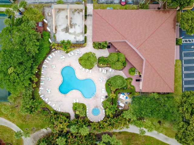 a view of a swimming pool and front of house