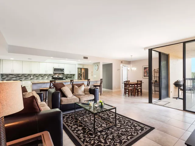 a living room with furniture and a rug