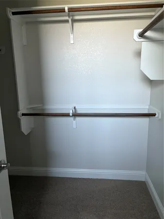 a bathroom with a double vanity sink and mirror