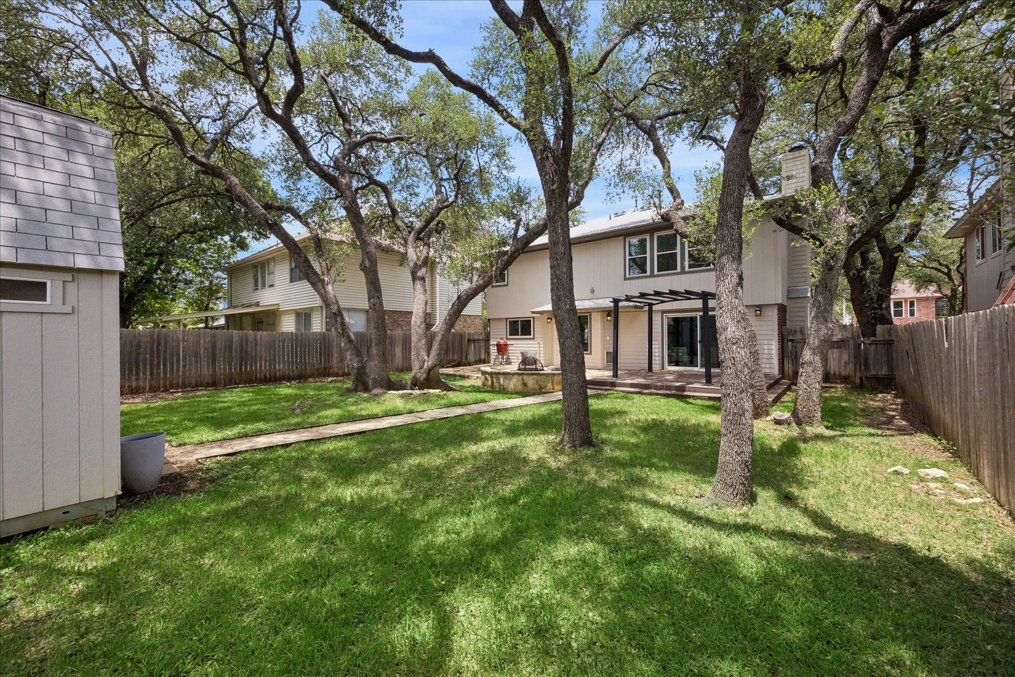 1306 Shady Grove Path Cedar Park, TX 78613 - Photo 38 of 40 a view of a house with backyard and a tree