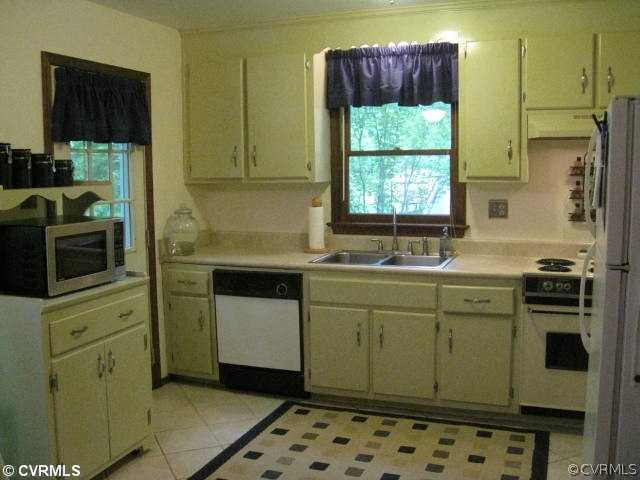 10231 North Donegal Road Chesterfield, VA 23832 - Photo 3 of 11 a kitchen with sink cabinets and window