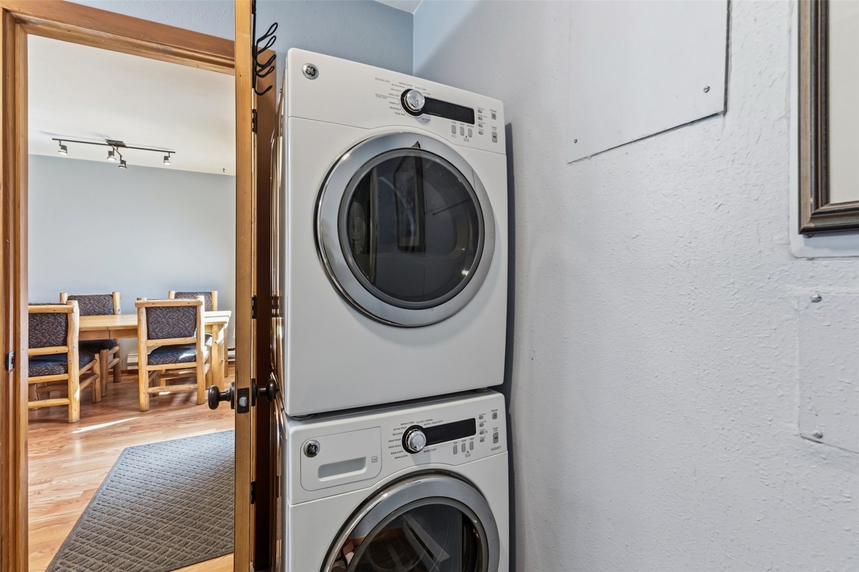 6734 Ryan Gulch Road, Unit 6734 Silverthorne, CO 80498 - Photo 28 of 33 a view of a hallway with washer and dryer