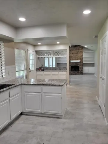 a large bathroom with a sink and a large mirror