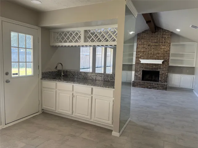 a kitchen with a sink and cabinets