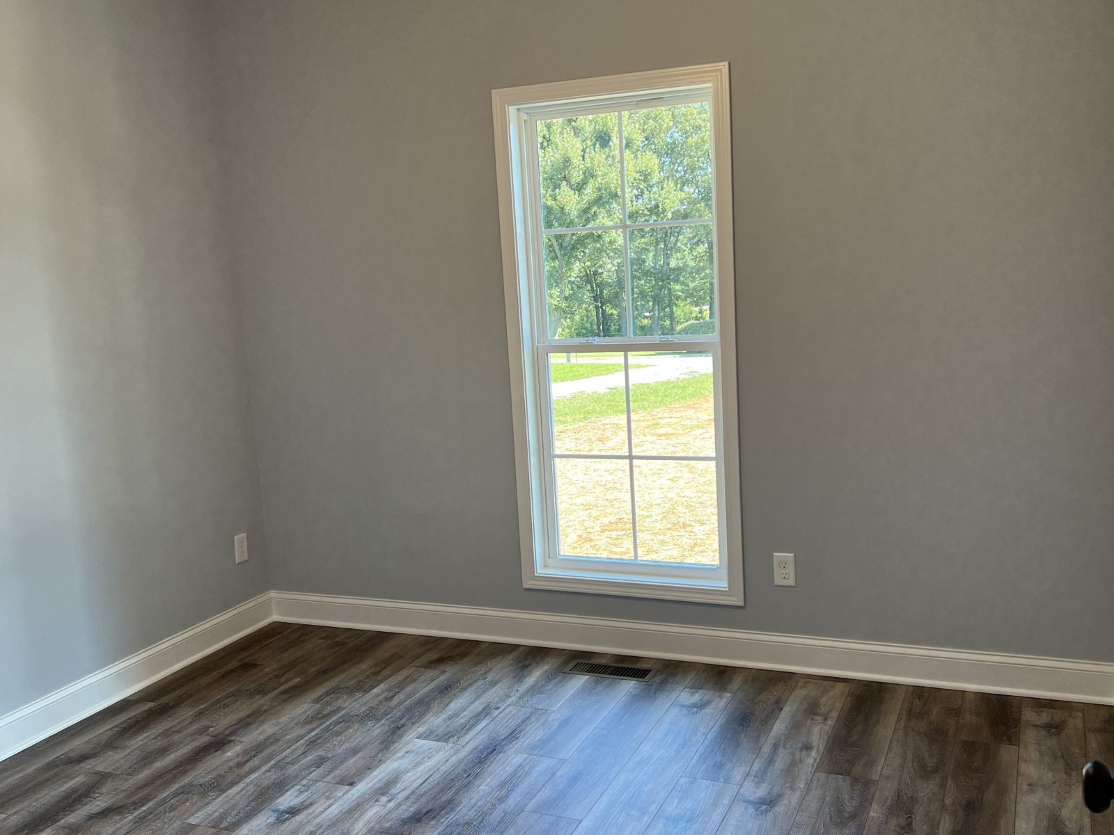 158 Faith-Rae Boulevard Morrison, TN 37357 - Photo 9 of 10 an empty room with wooden floor and windows