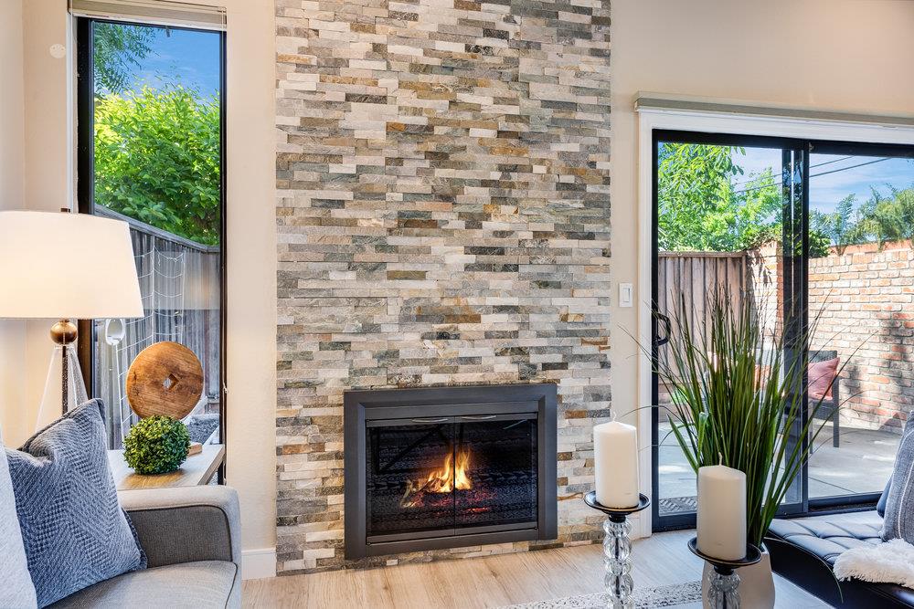 800 Rue Montagne Campbell, CA 95008 - Photo 18 of 53 a living room with furniture and a fireplace