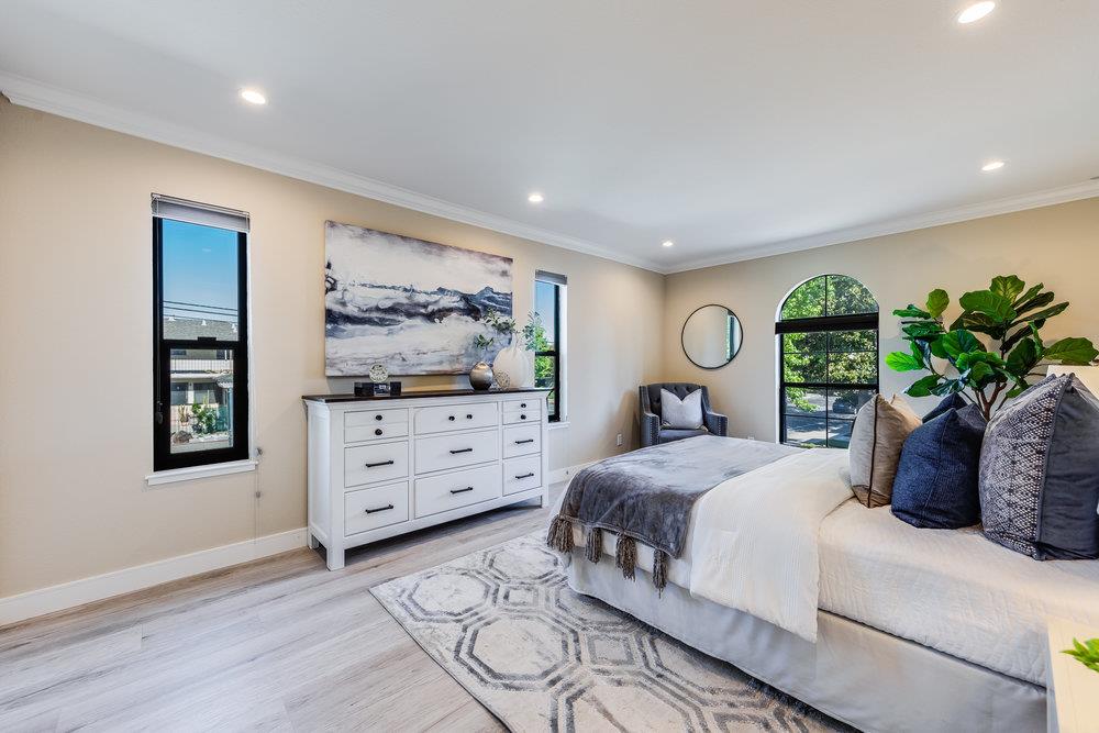 800 Rue Montagne Campbell, CA 95008 - Photo 23 of 53 a bedroom with a bed potted plant on dresser and a window