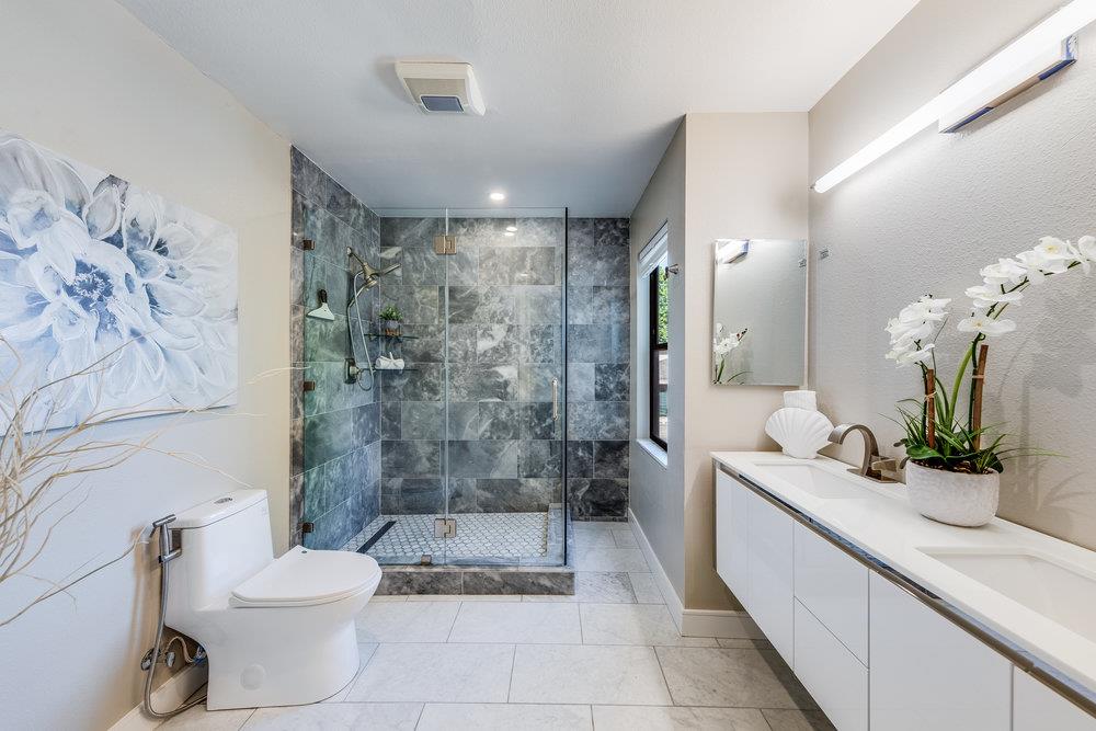 800 Rue Montagne Campbell, CA 95008 - Photo 27 of 53 a bathroom with a double vanity sink toilet and shower