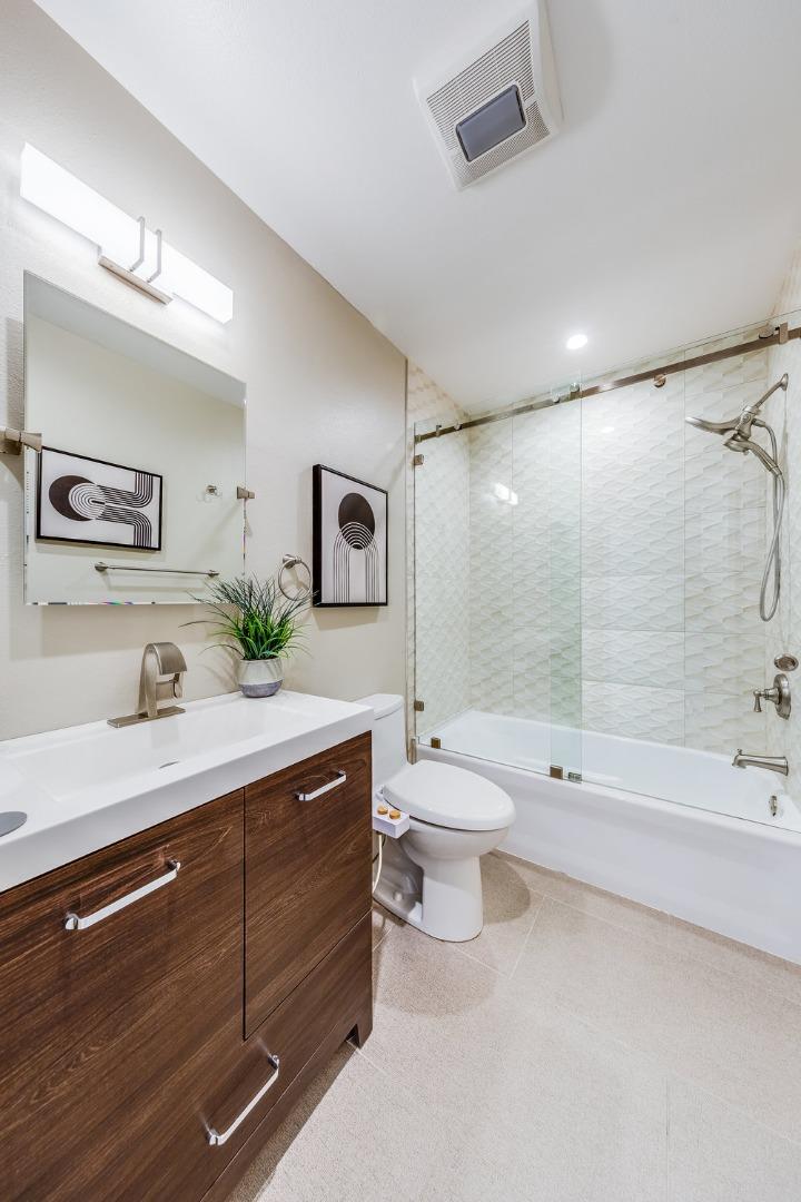 800 Rue Montagne Campbell, CA 95008 - Photo 34 of 53 a bathroom with a sink a toilet and a large mirror