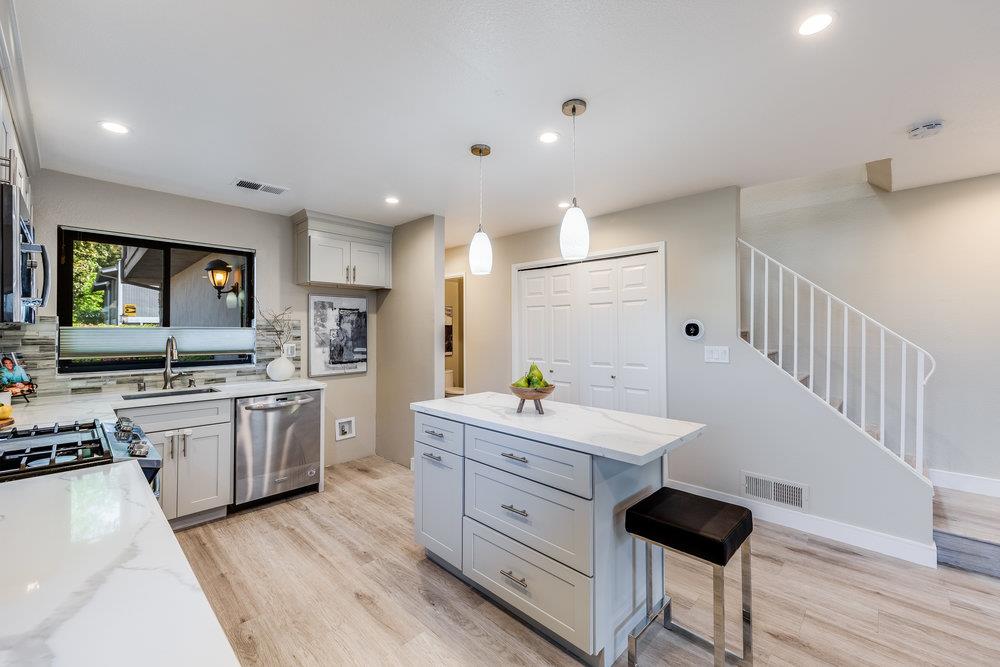 800 Rue Montagne Campbell, CA 95008 - Photo 9 of 53 a large kitchen with a lot of counter space and wooden floor