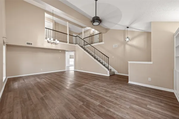 a view of an entryway with wooden floor