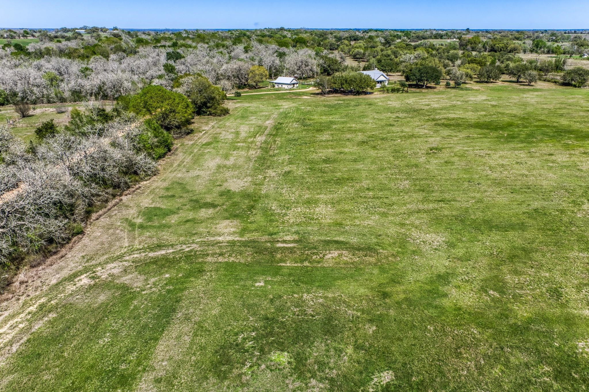 11646 Schuster Road Round Top, TX 78954 - Photo 4 of 8 a view of an outdoor space and a yard