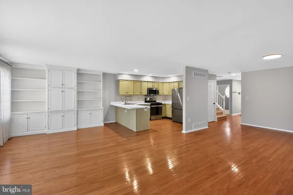 a view of kitchen with wooden floor