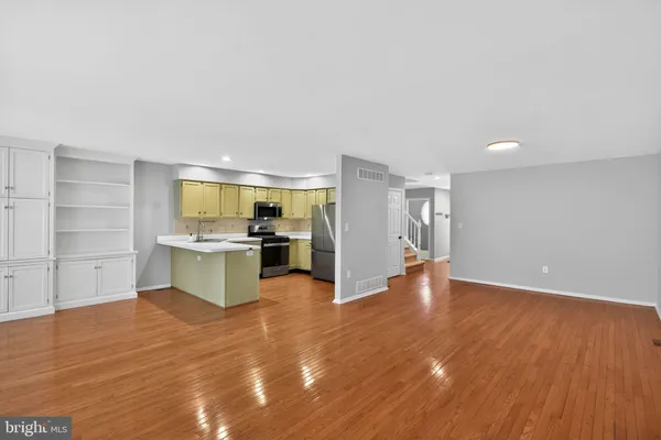 a view of kitchen with wooden floor