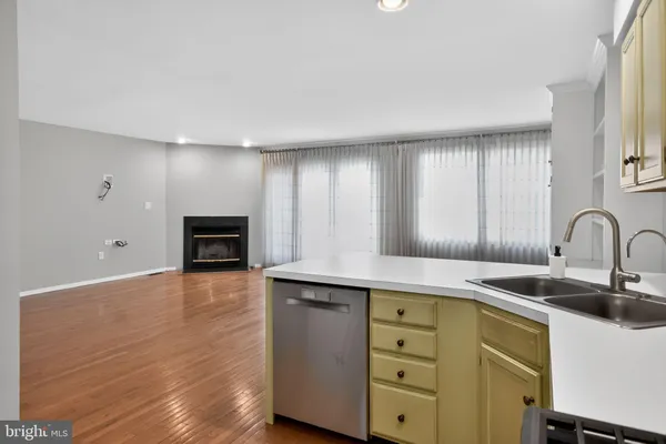 a kitchen with cabinets a sink and appliances
