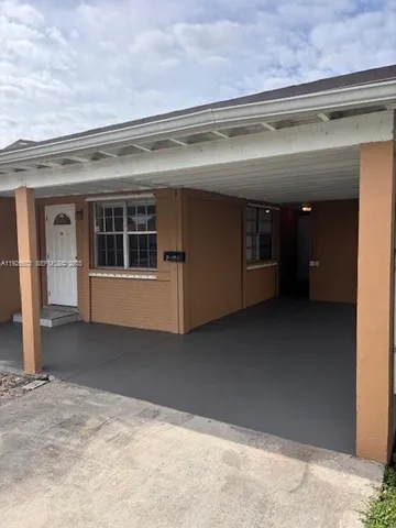 a kitchen with stainless steel appliances kitchen island granite countertop a sink and cabinets