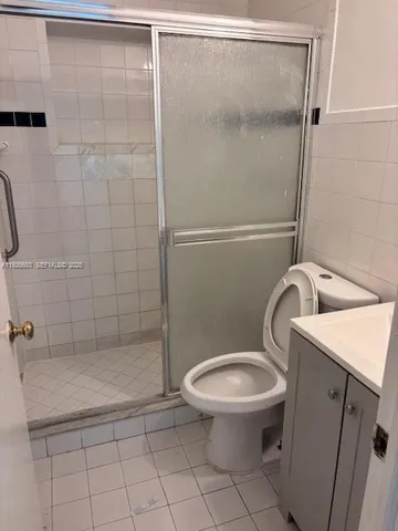 a bathroom with a toilet and bathtub