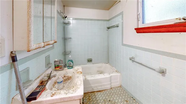 a bathroom with a sink and a bathtub