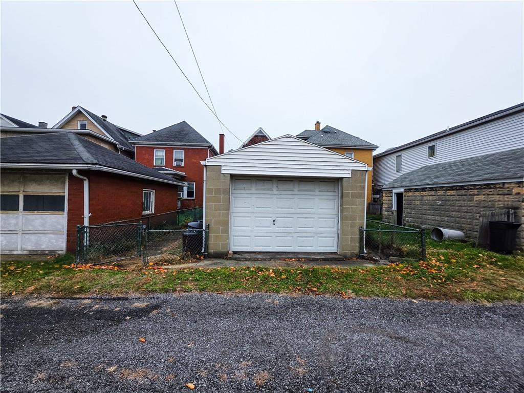 1022 Melrose Avenue Ambridge, PA 15003 - Photo 28 of 39 a view of a house with a yard and garage