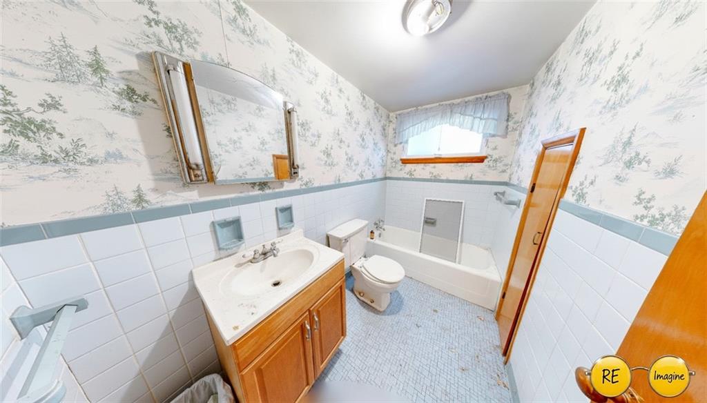 1022 Melrose Avenue Ambridge, PA 15003 - Photo 37 of 39 a bathroom with a sink and a mirror