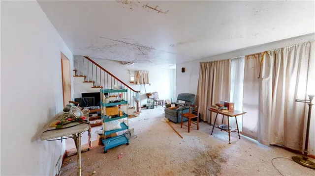 a view of a livingroom with furniture and window