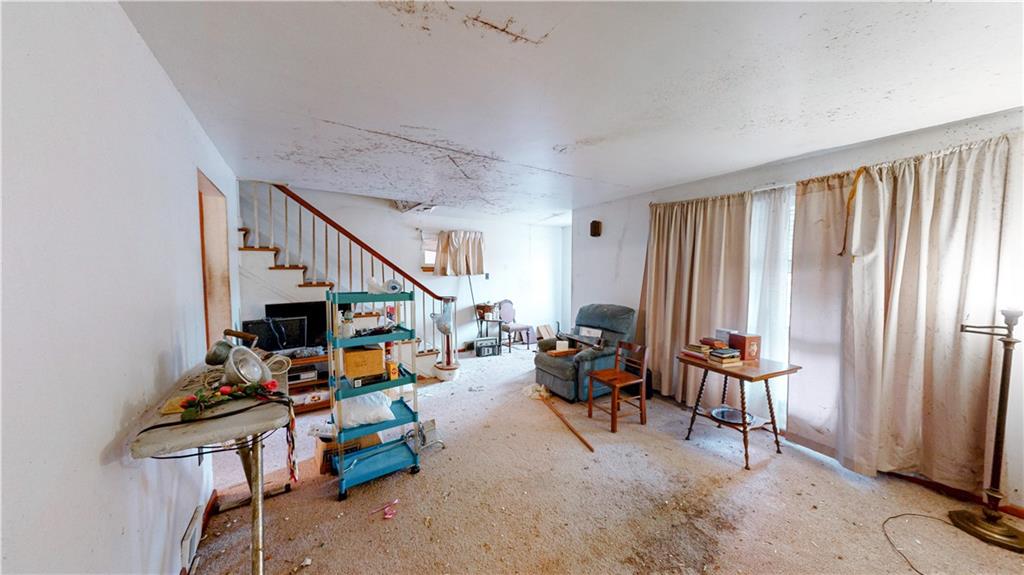 1022 Melrose Avenue Ambridge, PA 15003 - Photo 6 of 39 a view of a livingroom with furniture and window