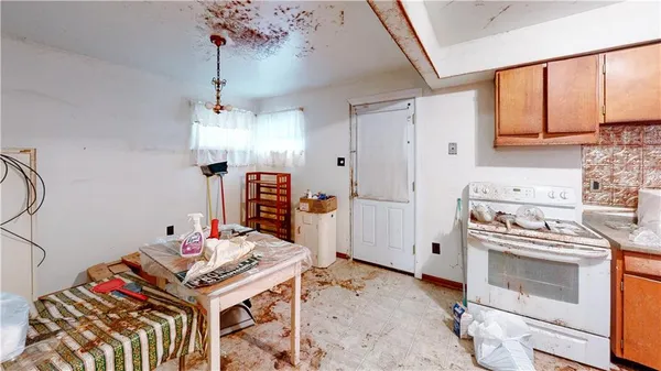 a kitchen that has a stove and a table